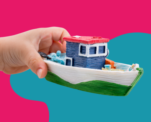 Child holding a toy boat